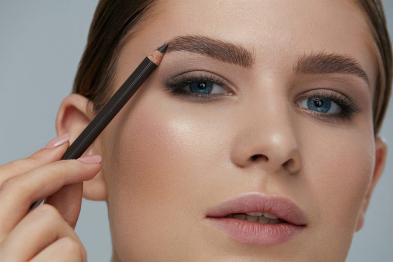 beauty,makeup.,woman,shaping,eyebrow,with,brow,pencil,closeup.,girl